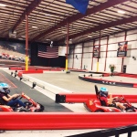 Conner and Alexis racing go-karts at autobahn indoor speedway